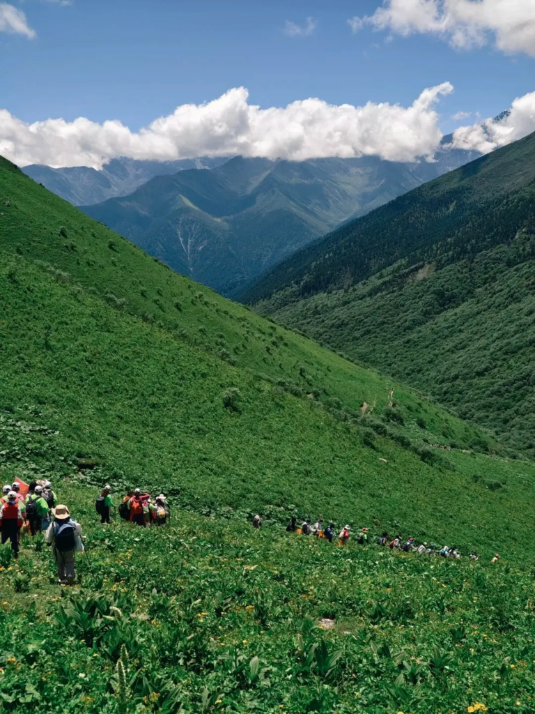 Group of hikers trekking in Balang Mountain in Sichuan
