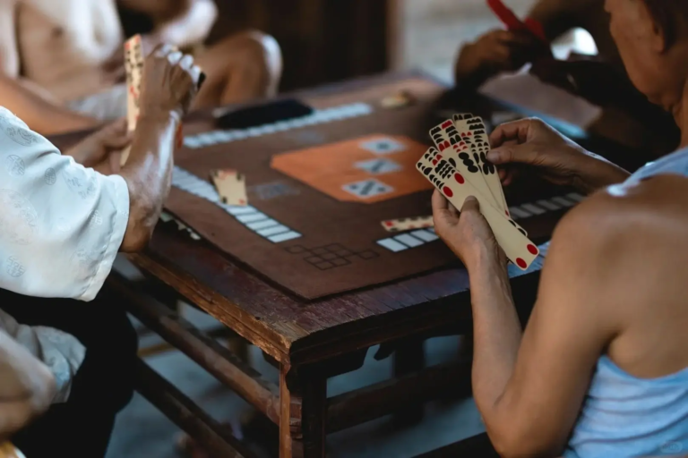 Local life in Chengdu teahouse with people playing Card