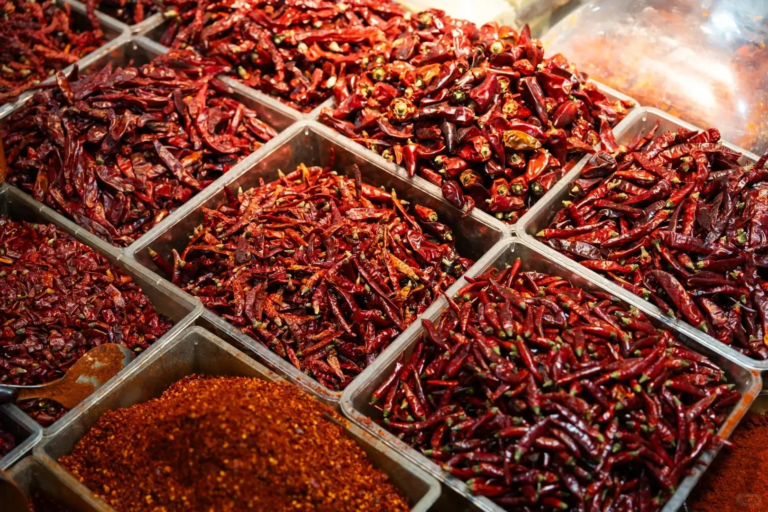 Spice stall in Chengdu local market with various dried chilies and spices