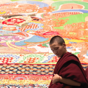 Monks displaying giant Thangka during the Shoton Festival in Tibet