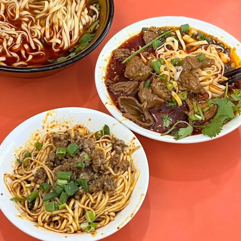 Traditional Sichuan noodles served with chili oil and local seasonings