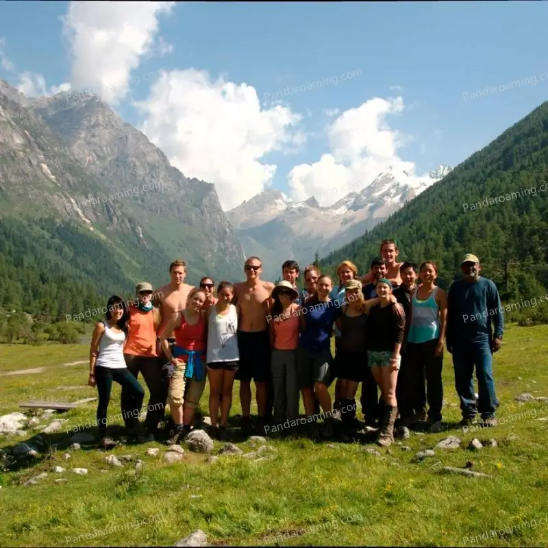 A group of young travelers standing in a grassland landscape in Western Sichuan