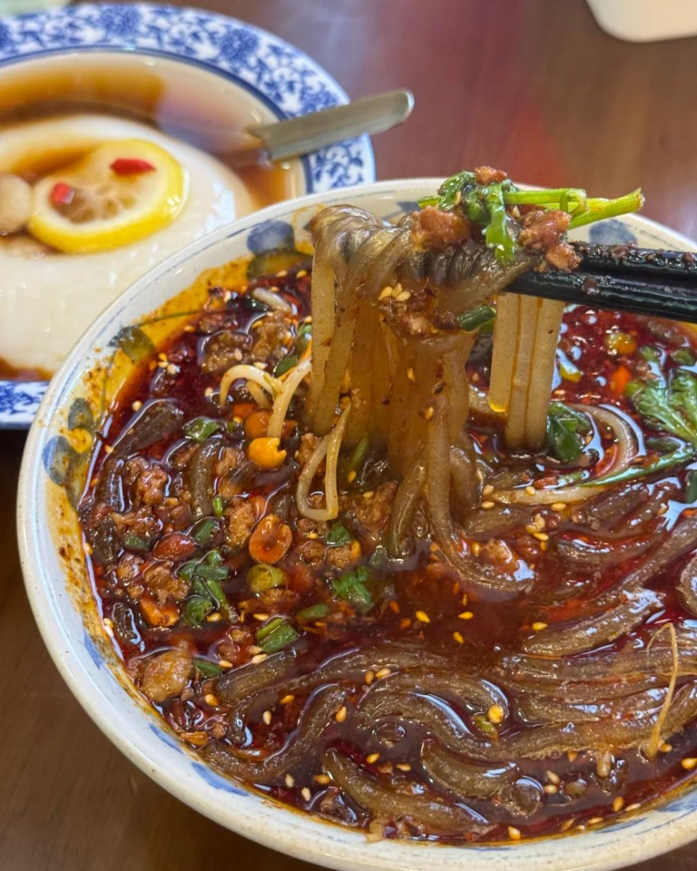 Chongqing spicy sweet potato noodles with chili oil, peanuts, and Sichuan seasonings