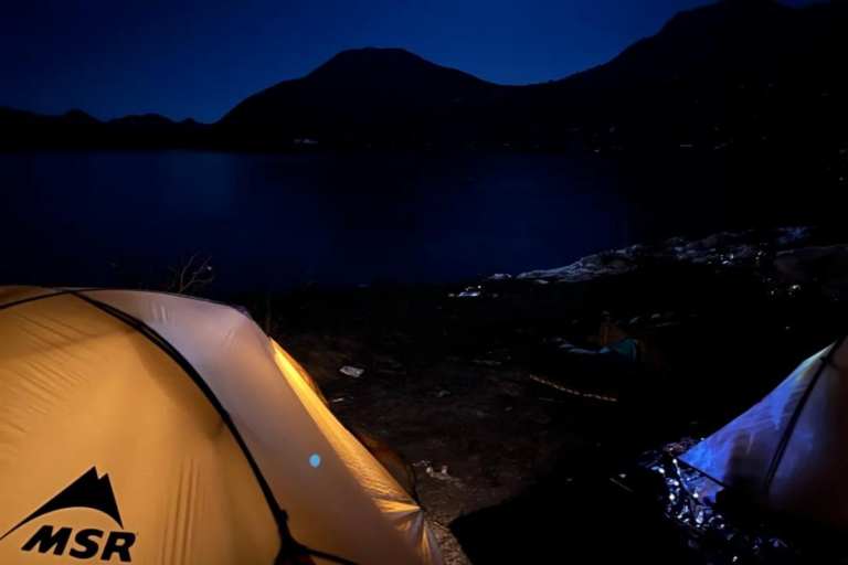 Night campsite with tents during the Dangling trekking experience in Sichuan