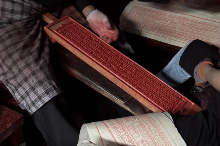 Traditional woodblock printing display at Dege Printing House in Sichuan