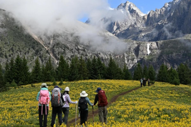Hiking across alpine pastures near Mount Genie in Western Sichuan
