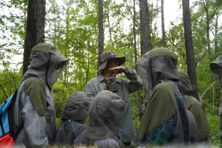 Travelers joining a guided wildlife watching experience in Sichuan, China