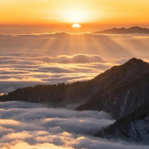Sunrise above a sea of clouds on Huajianshan Mountain in Sichuan