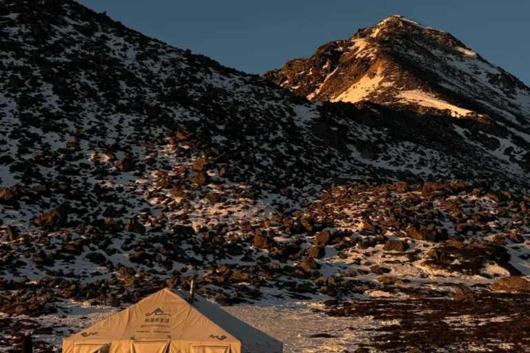 Sunset campsite with tents during the Langkaxin trekking experience in Sichuan