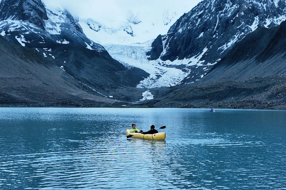 Leduomanyin Ice Lake Trek Western Sichuan Traveler kayaking on Leduomanyin Ice Lake in Western Sichuan