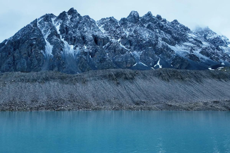 Leduomanyin Ice Lake surrounded by mountain landscapes in Western Sichuan