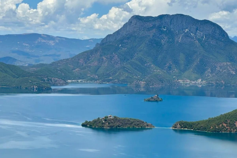Scenic Lugu Lake surrounded by mountains in Southwest China