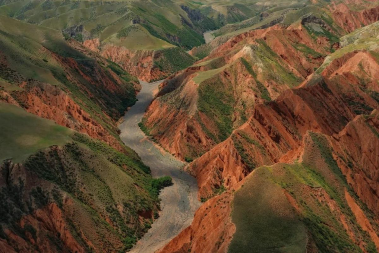 Scenic S101 Danxia Highway passing through colorful landscapes in Xinjiang