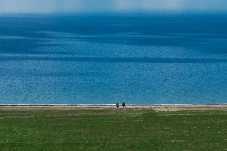 Sayram Lake surrounded by mountains in Xinjiang