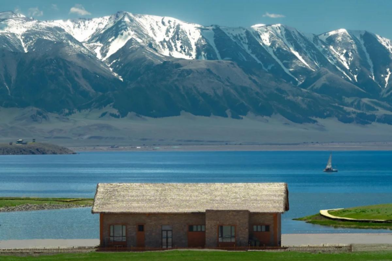 Turquoise waters and mountain scenery at Sayram Lake in Xinjiang