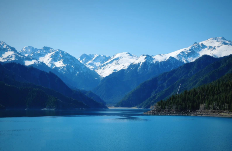 Tianchi Lake surrounded by mountains in the Tianshan Mountains, Xinjiang