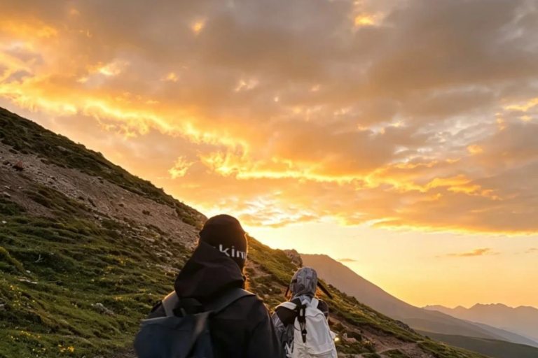 Hiker walking through Yema Haizi with sunset mountain views in Sichuan