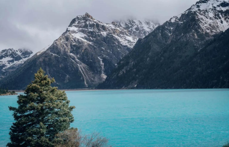 Yulong Latso Lake surrounded by mountains in Western Sichuan